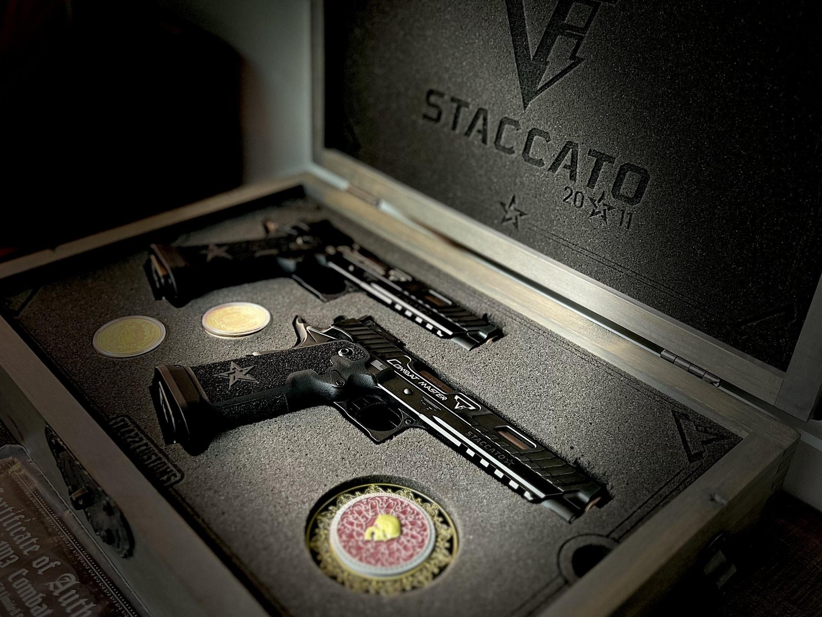 Premium handgun displayed in a presentation case at Academy Arms and Optics